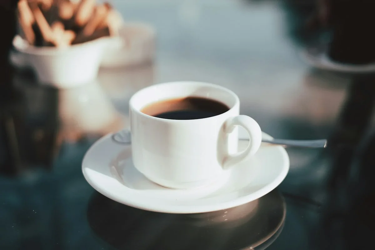 Americano black coffee in a white cup