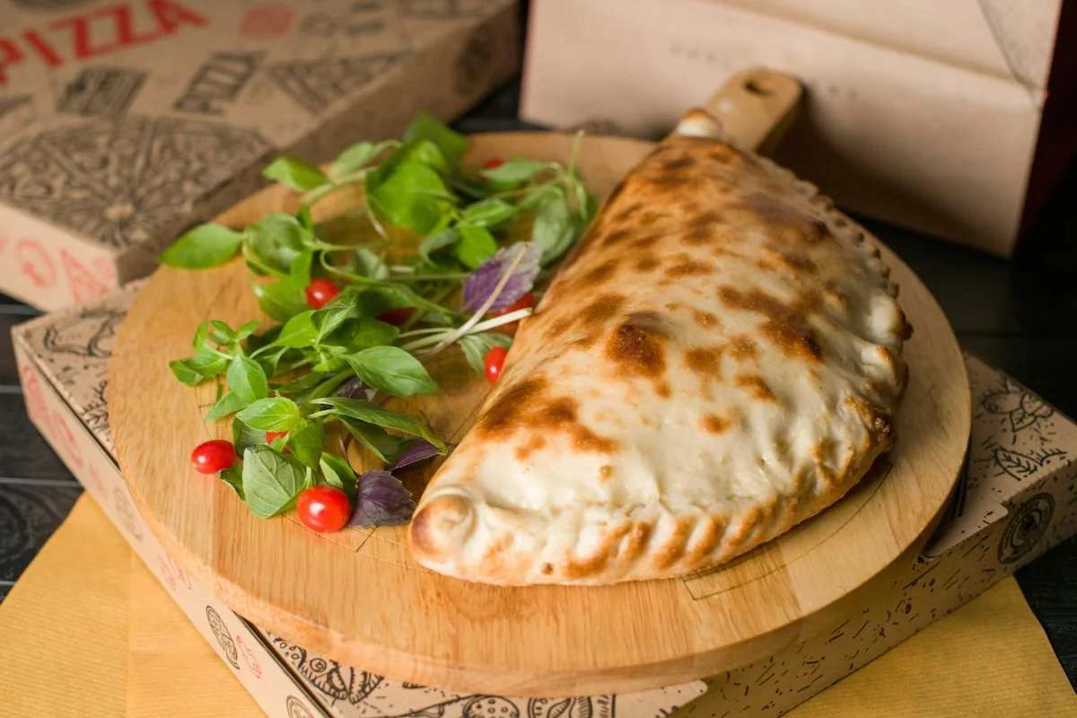 Baked calzone served with salad