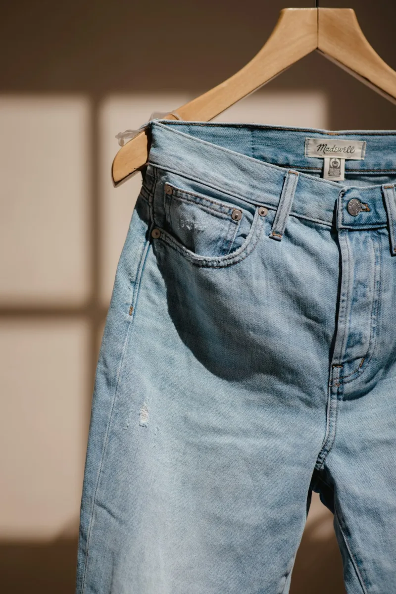Blue denim jeans on a hanger