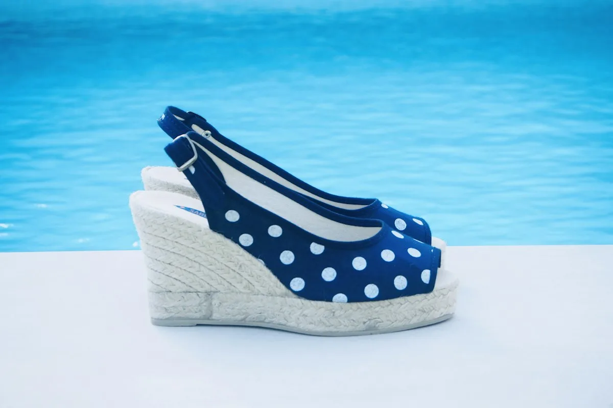 Blue polka dot wedge heels with a rope sole