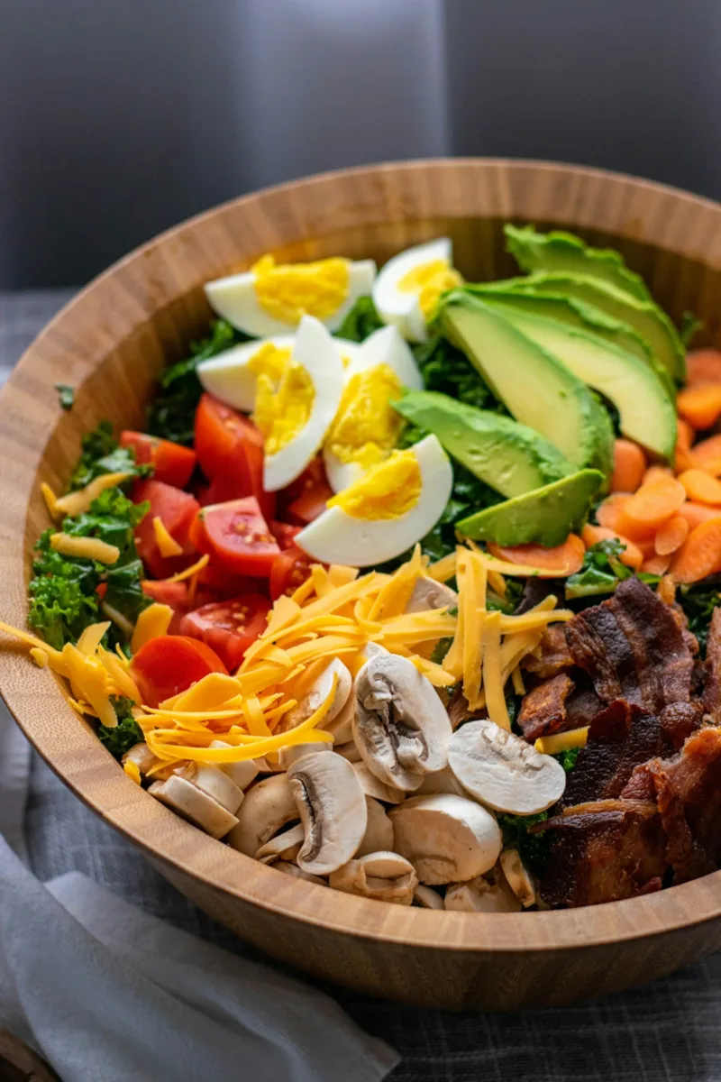 Cobb salad with egg and avocado arranged in rows