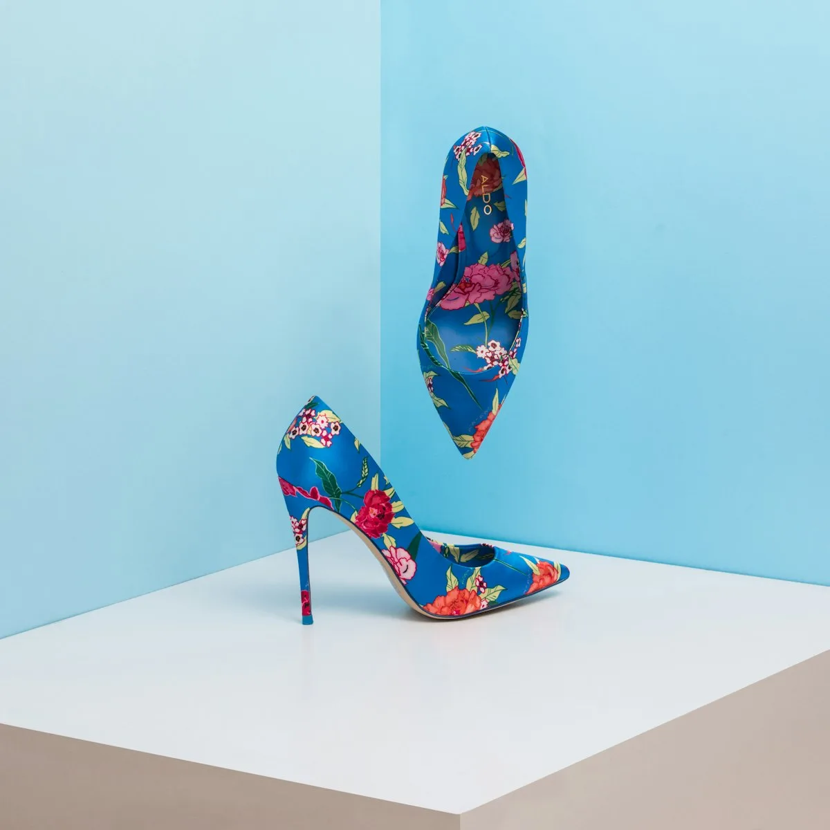 Colorful high heel shoe on a blue background