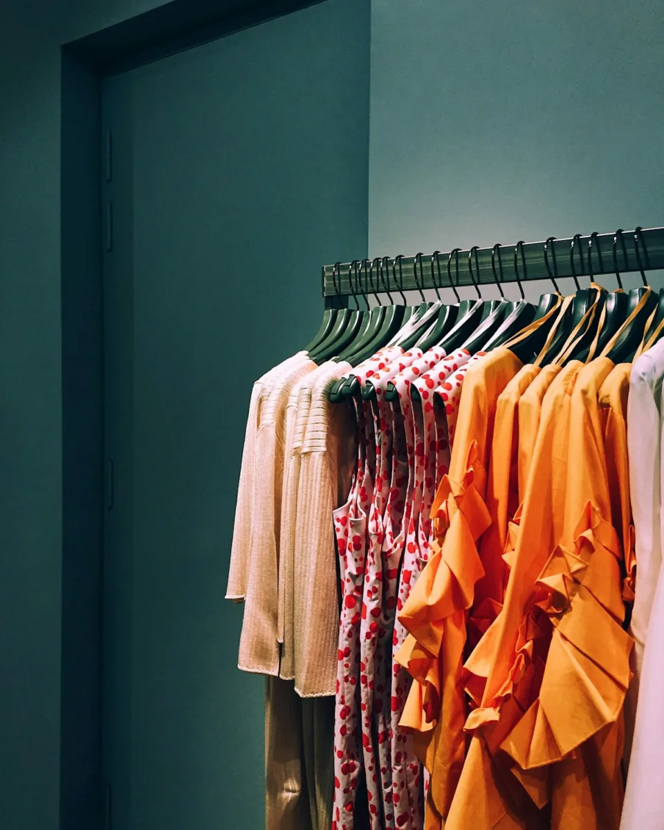 Different types of dresses hanging on a clothing rack