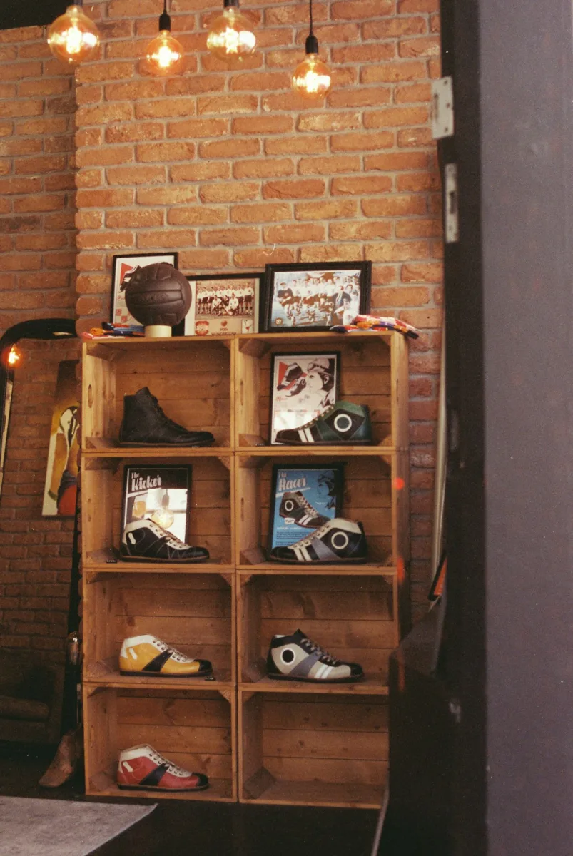Different types of shoes arranged on shelves