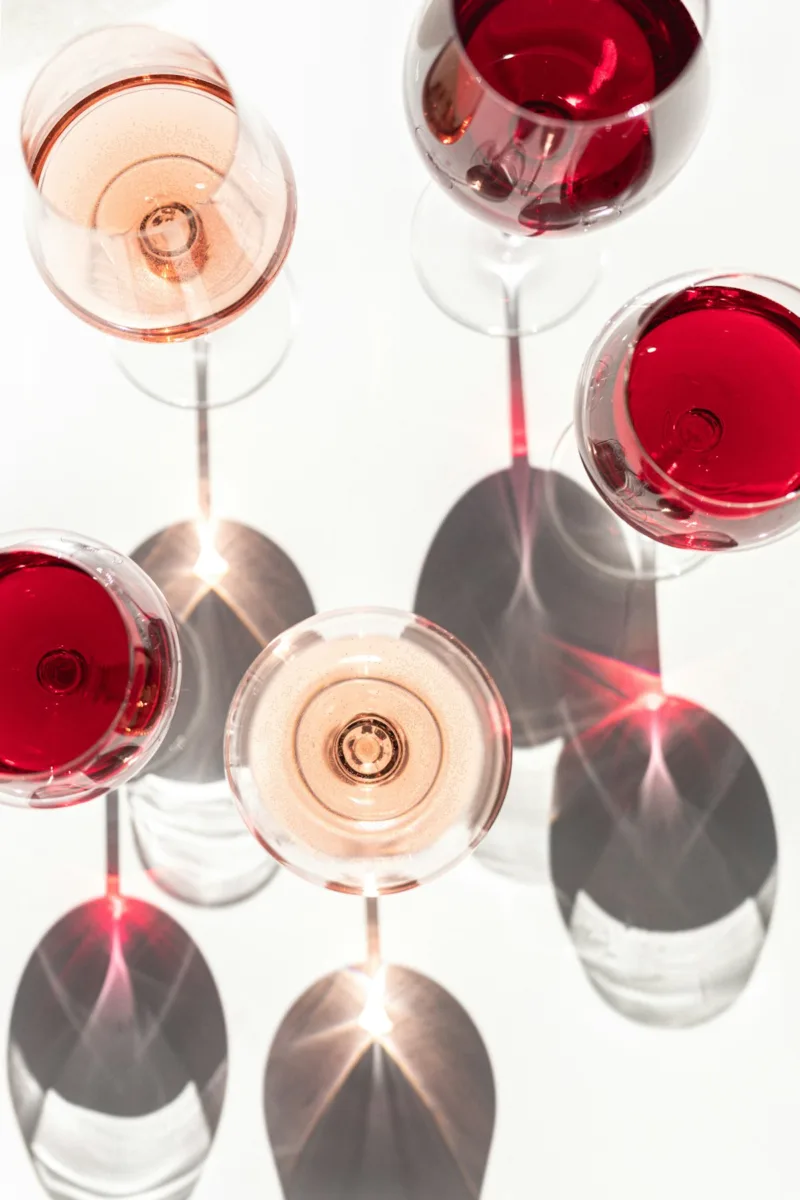 Different types of wine in glasses seen from above