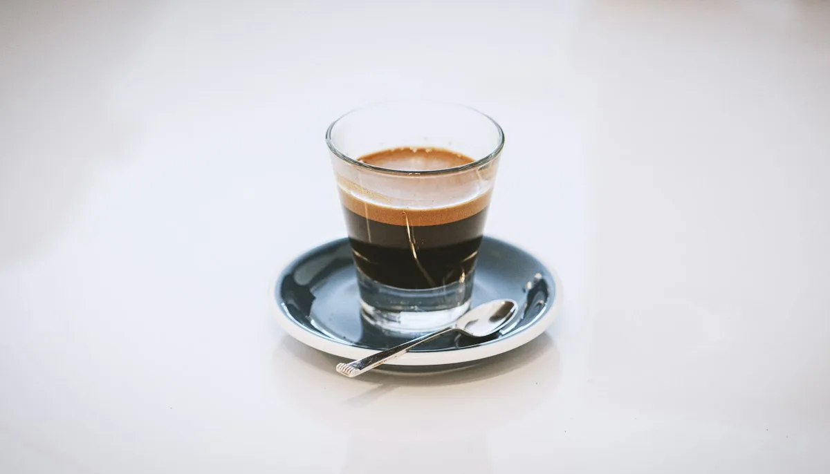 Espresso coffee in a small glass cup