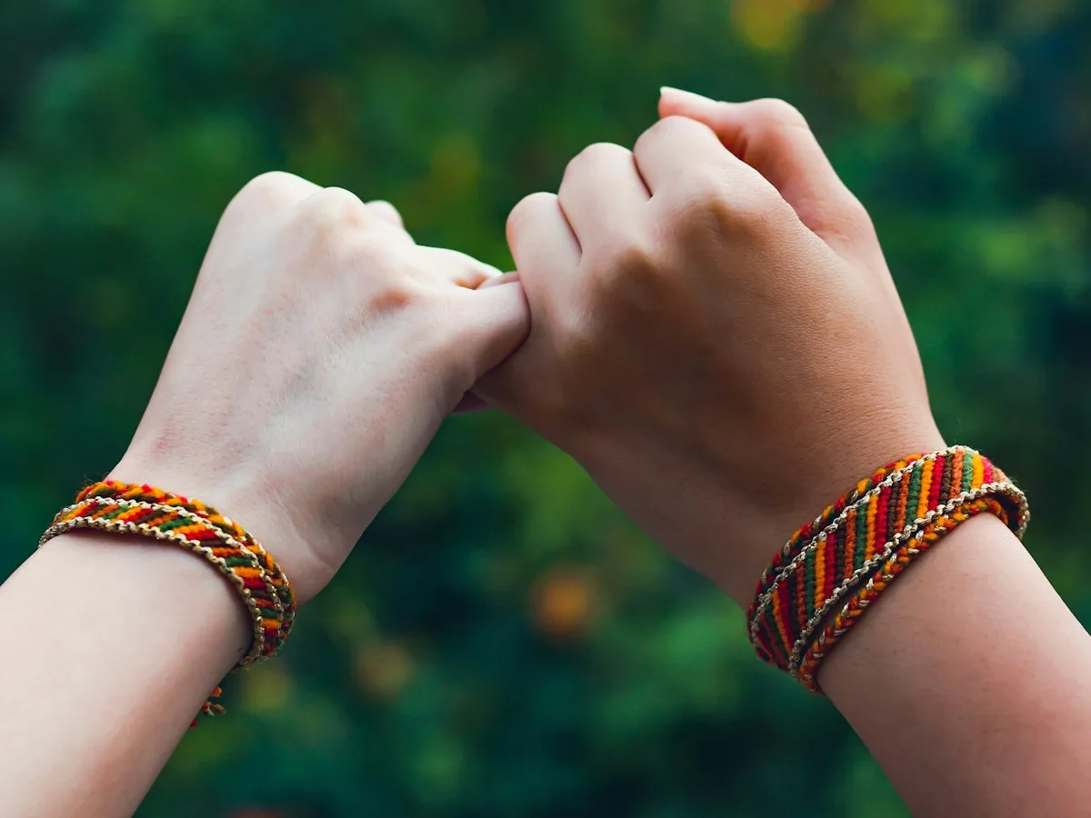 Friendship bracelets on wrists