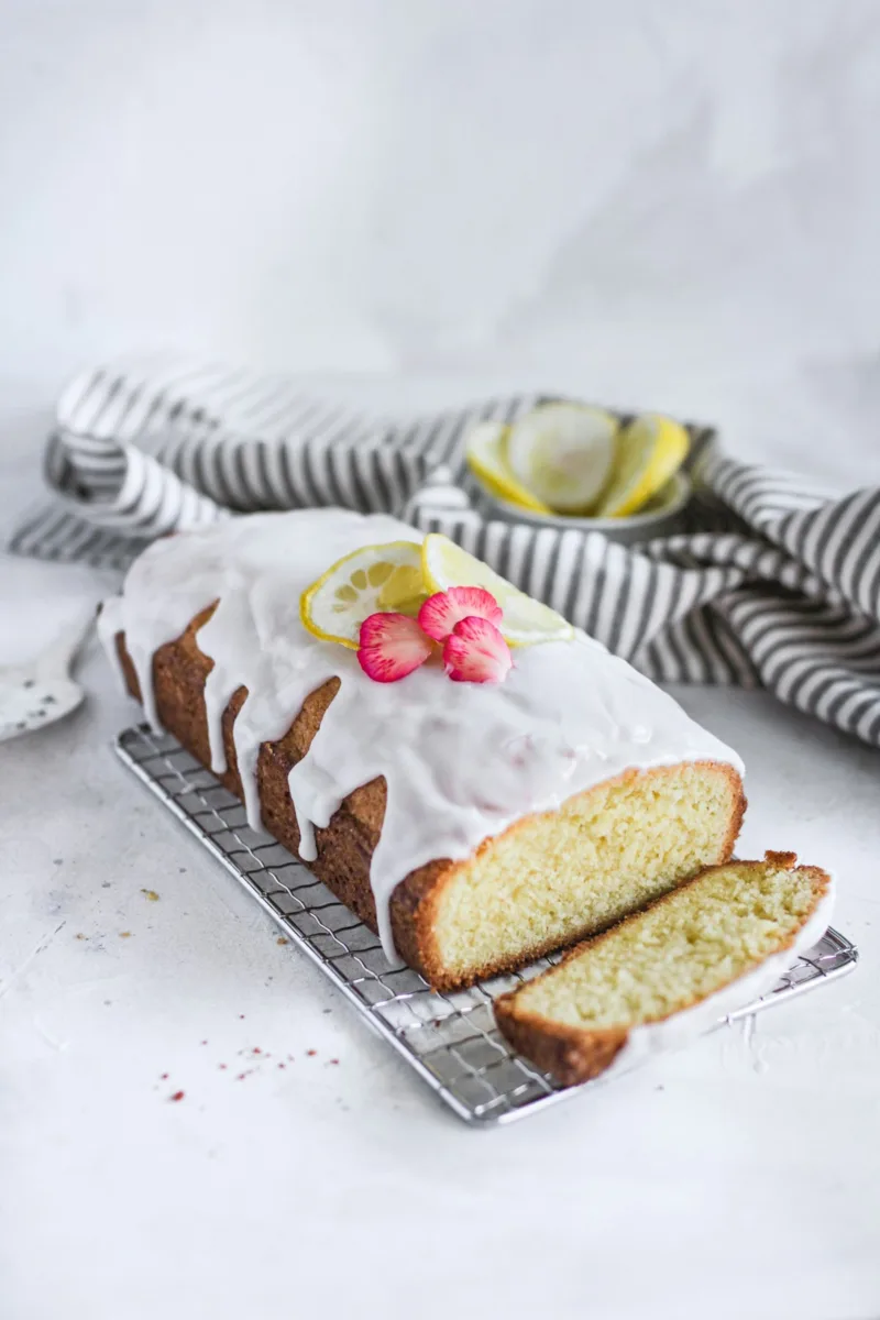 Iced loaf cake with slices cut