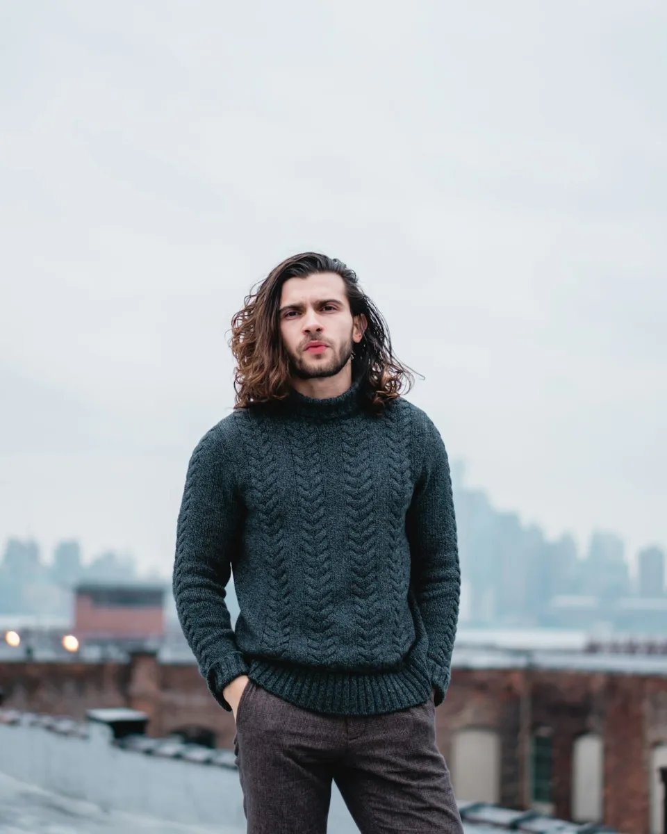 Man wearing a green turtleneck sweater