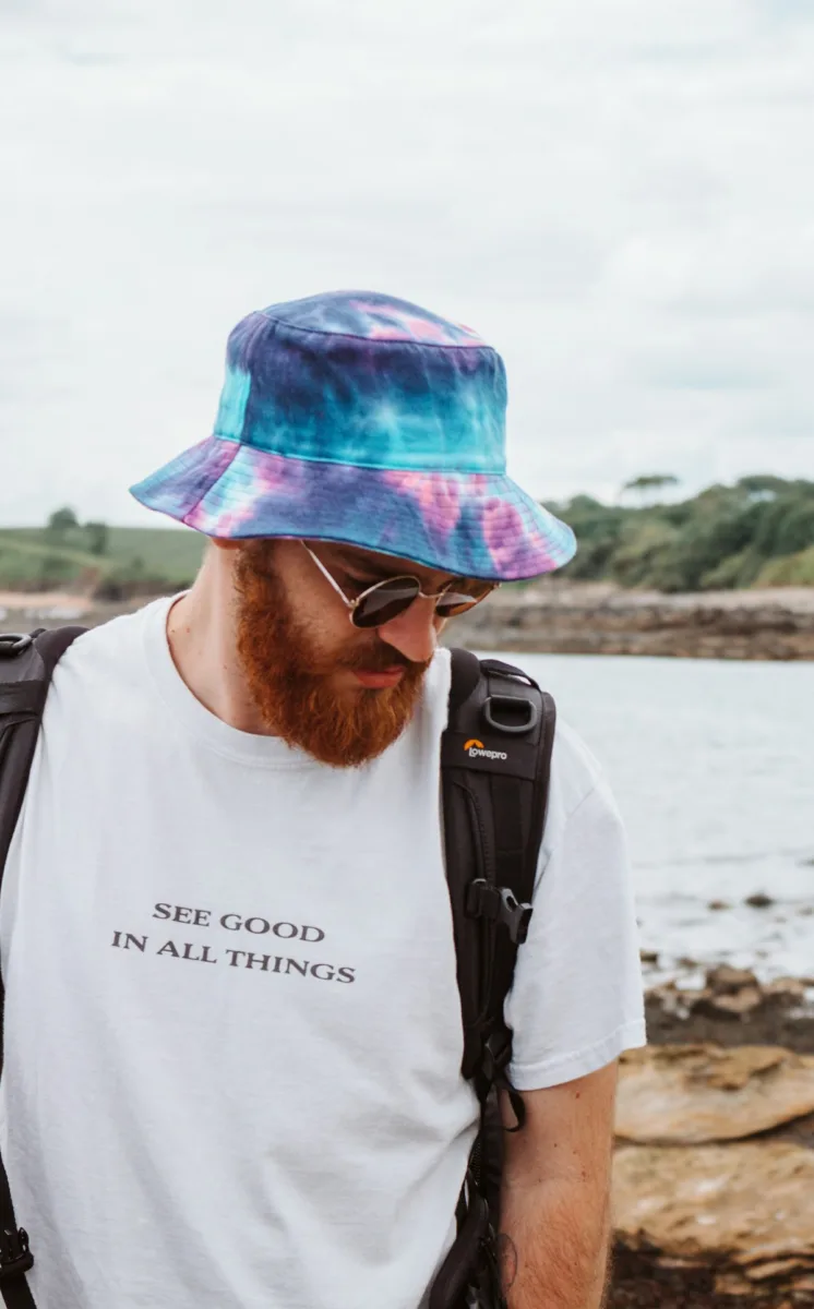 Man wearing a tie-dye bucket hat