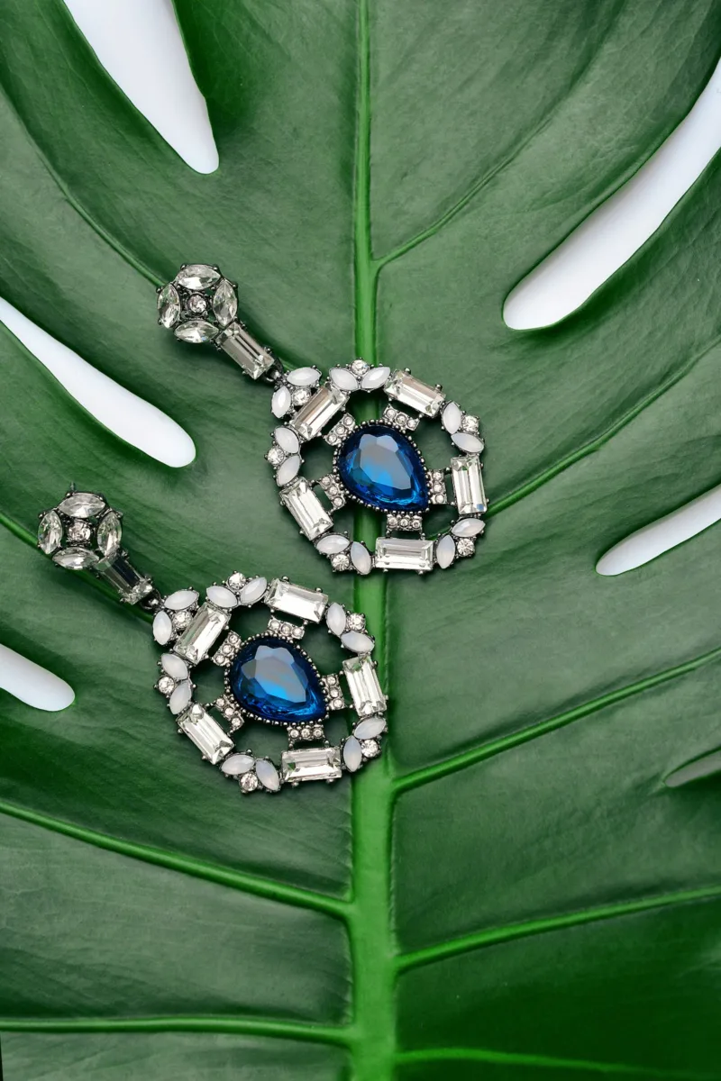 Ornate earrings with blue stones