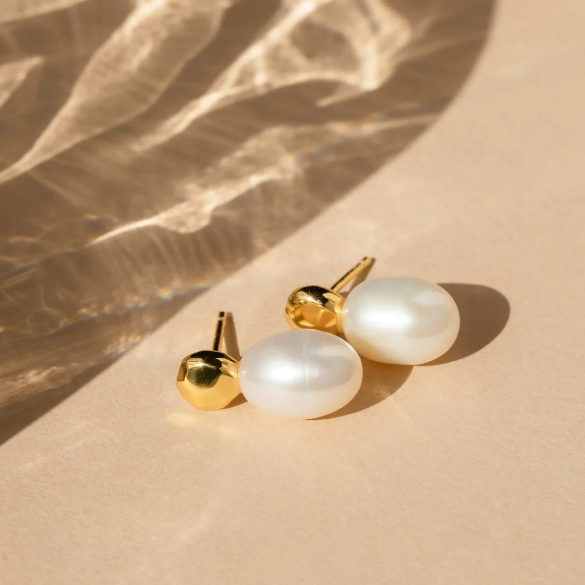 Pearl stud earrings with gold posts
