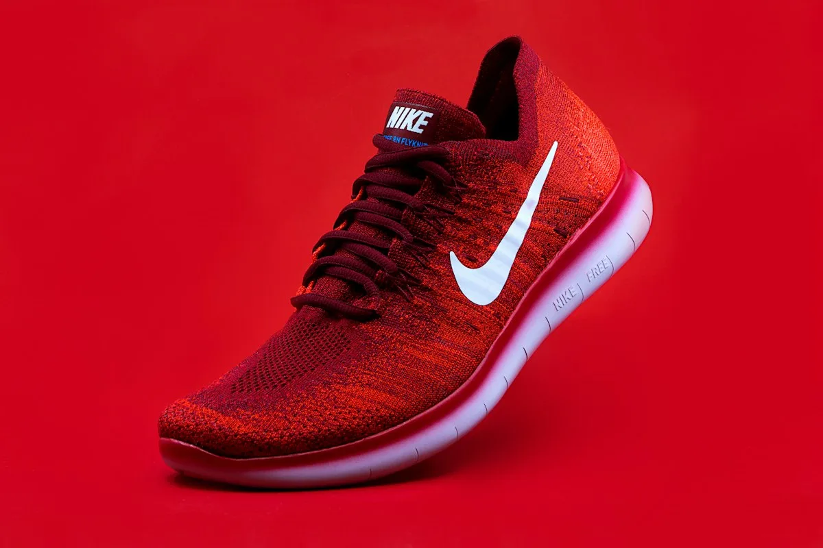 Red running shoe with a cushioned sole