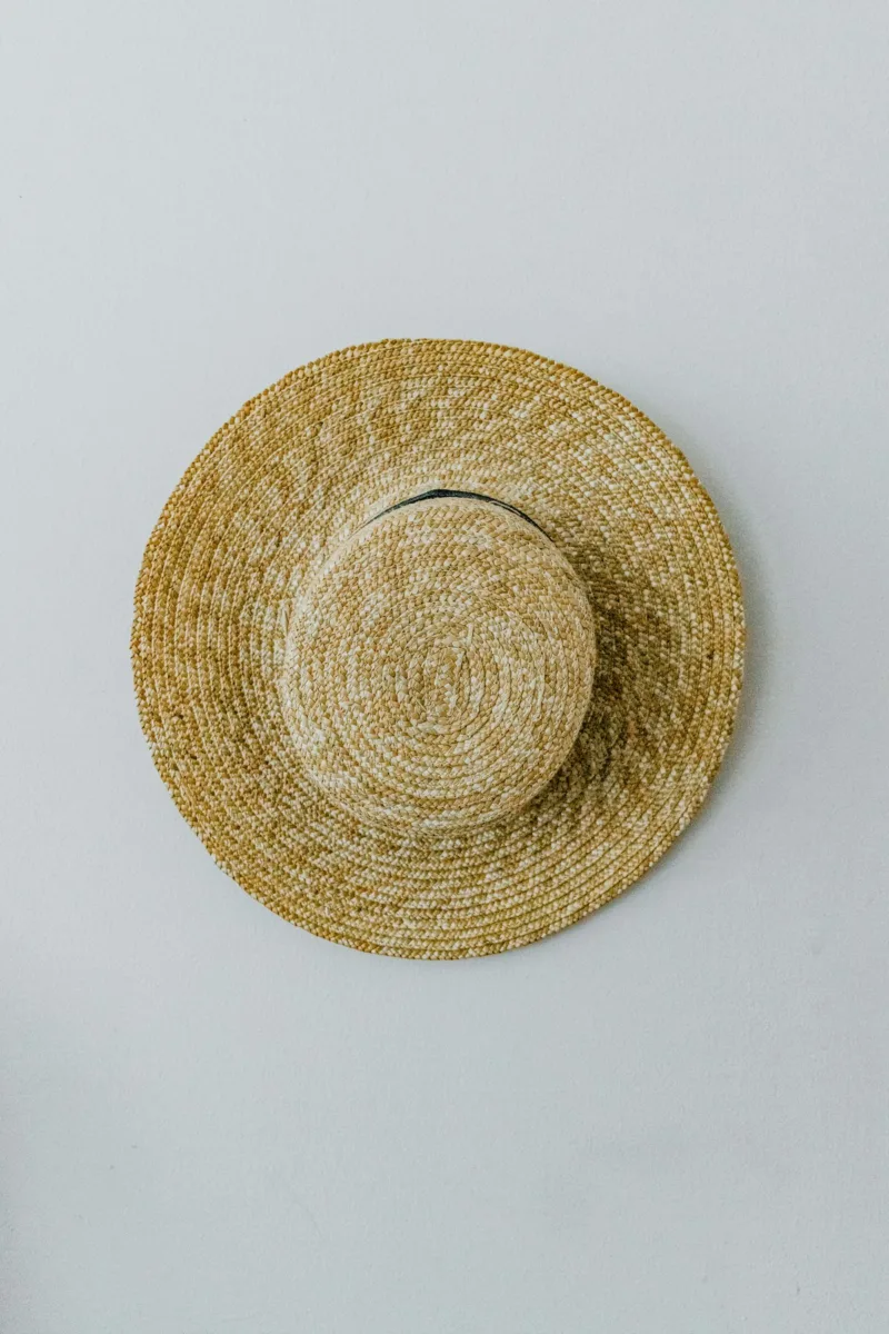 Straw boater hat with a flat crown and brim