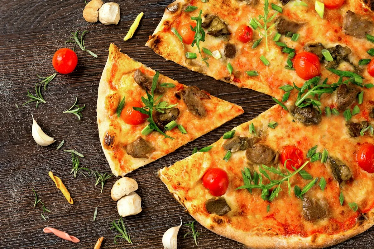 Vegetable pizza cut into slices