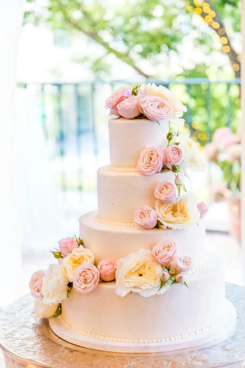 White tiered wedding cake with flowers