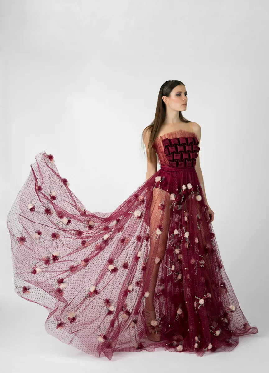 Woman in a red ball gown with a full skirt