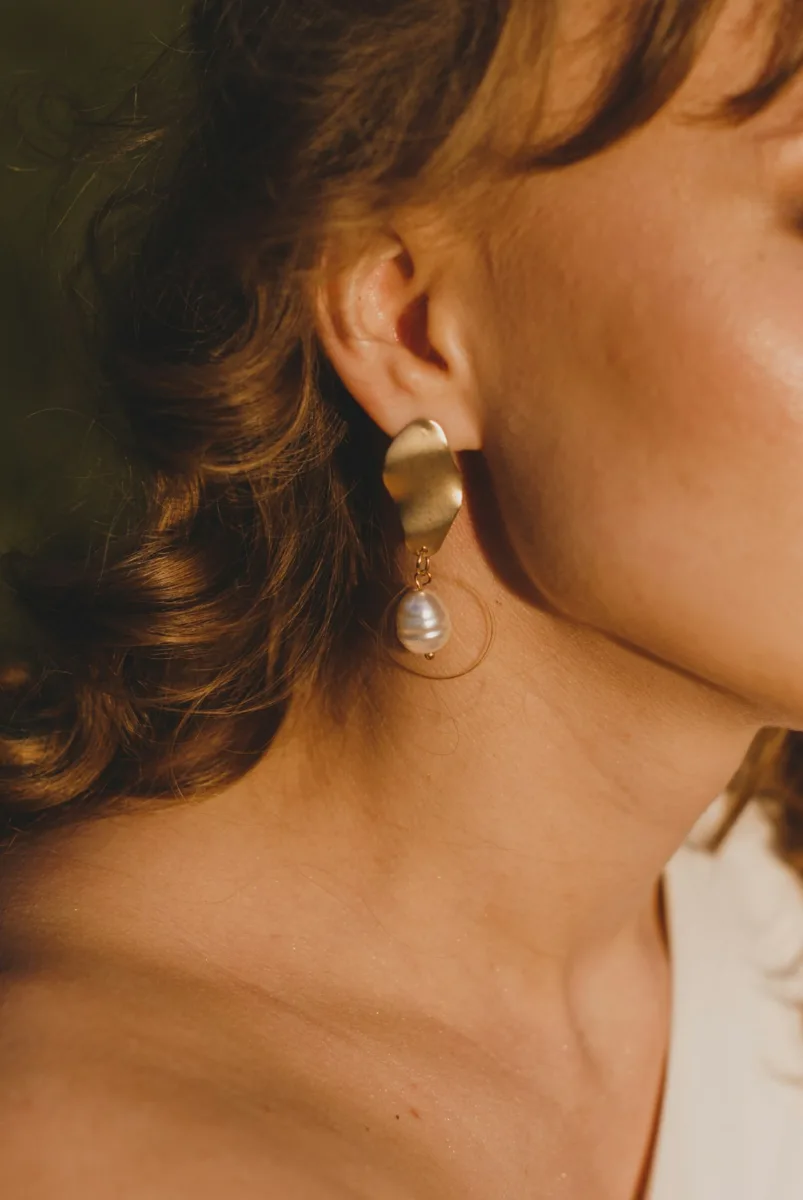 Woman wearing a drop earring