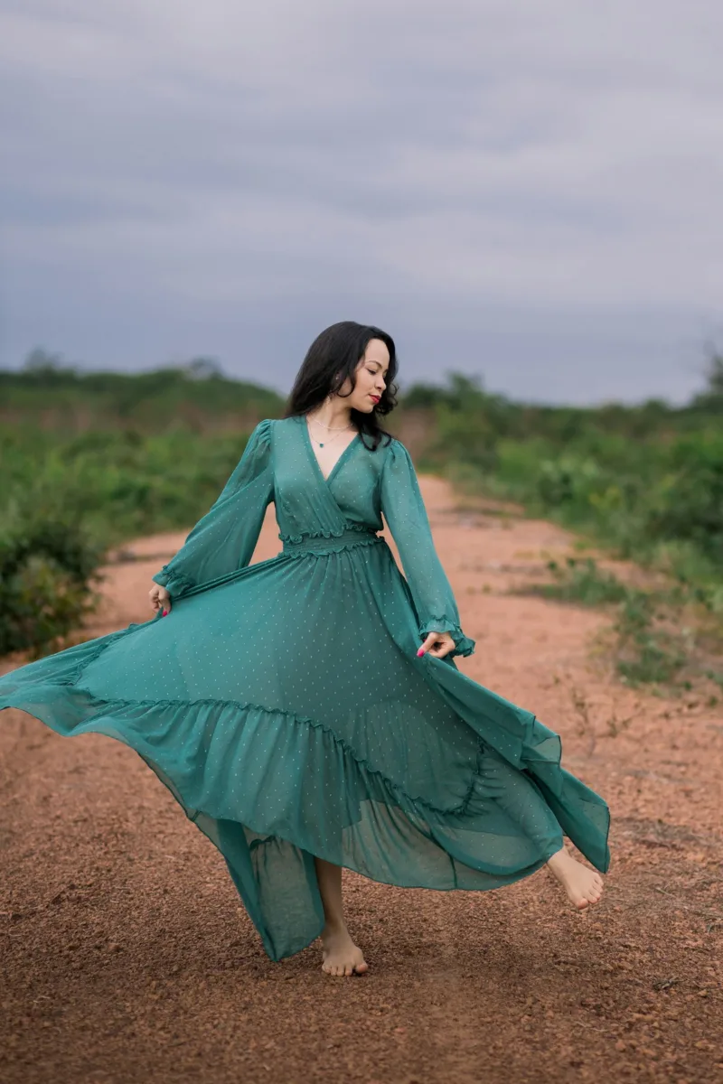 Woman wearing a long green maxi dress