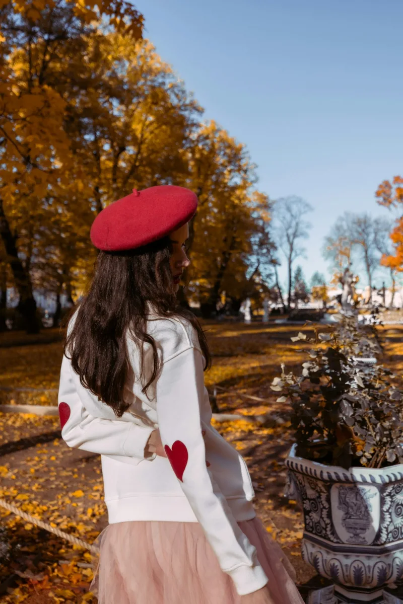 Woman wearing a red beret hat