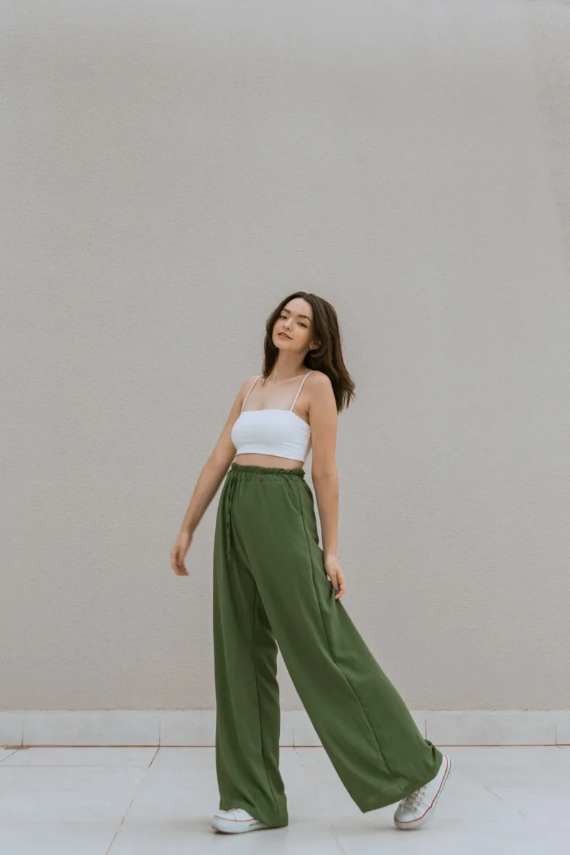 Woman wearing green wide leg pants